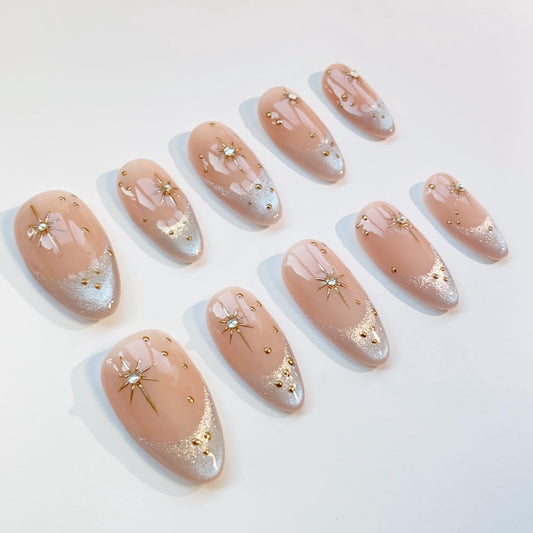 Luxury Nude Gold French Tip Press-On Nails with Starburst Rhinestone Design – Almond Shape Reusable Nail Set
