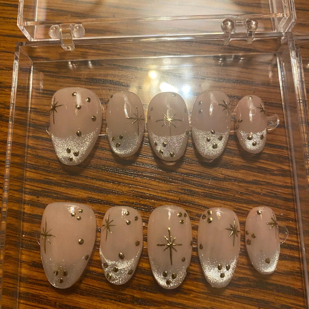 Luxury Nude Gold French Tip Press-On Nails with Starburst Rhinestone Design – Almond Shape Reusable Nail Set