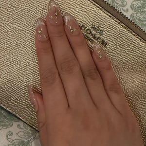 Luxury Nude Gold French Tip Press-On Nails with Starburst Rhinestone Design – Almond Shape Reusable Nail Set