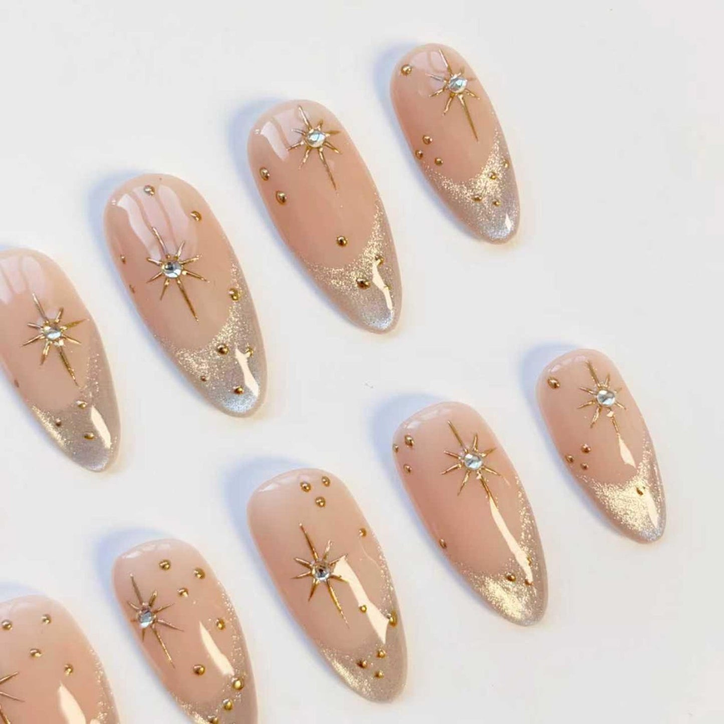 Luxury Nude Gold French Tip Press-On Nails with Starburst Rhinestone Design – Almond Shape Reusable Nail Set