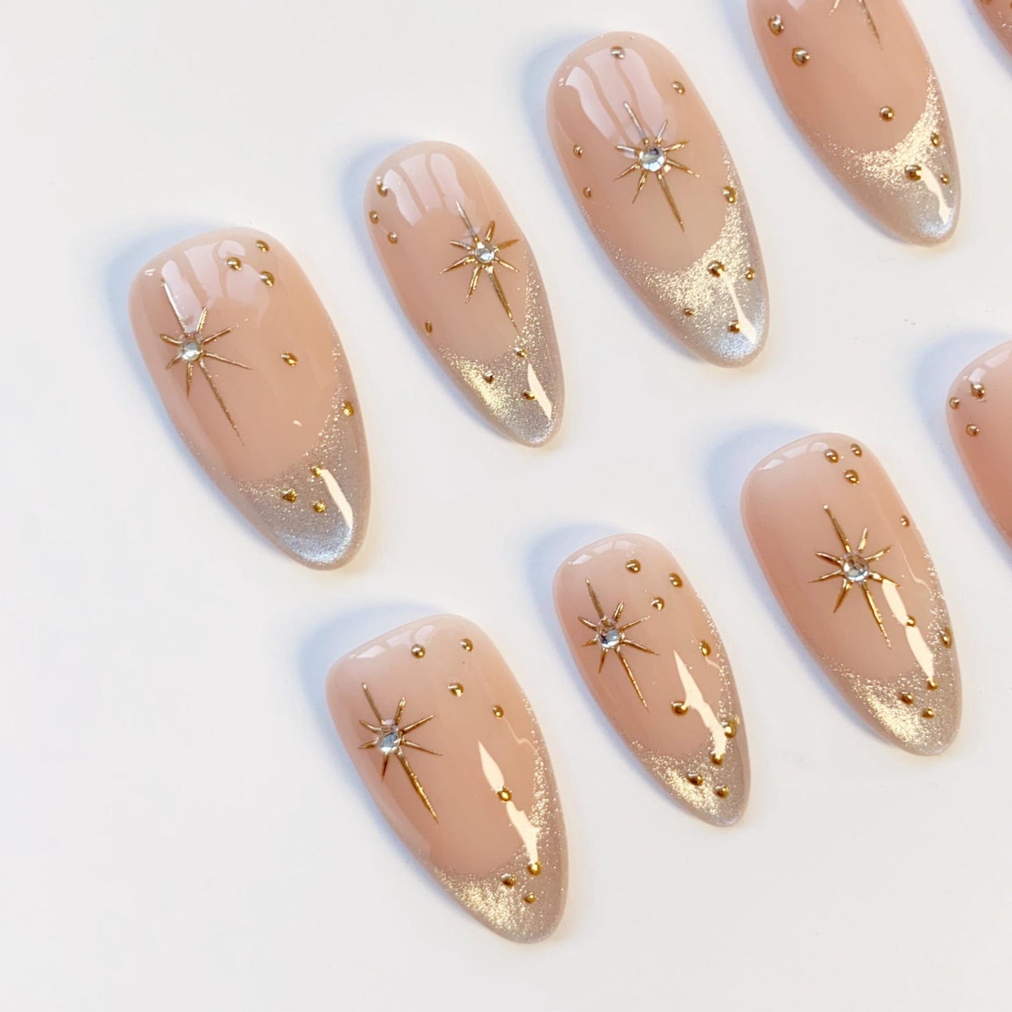 Luxury Nude Gold French Tip Press-On Nails with Starburst Rhinestone Design – Almond Shape Reusable Nail Set