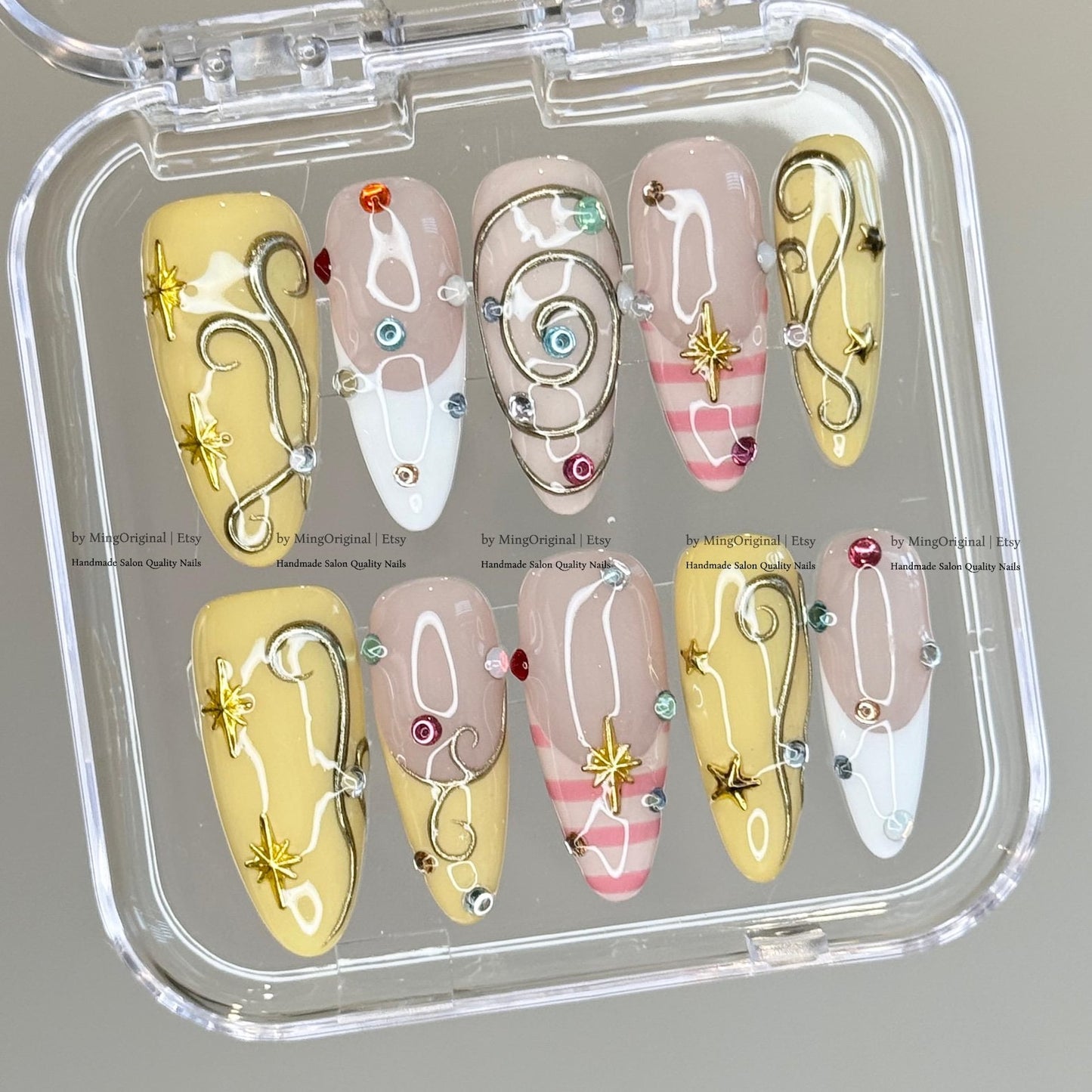 Pastel Celestial Press-On Nails – Handmade Yellow & Pink Swirl Nails with Crystal Charms and Star Accents