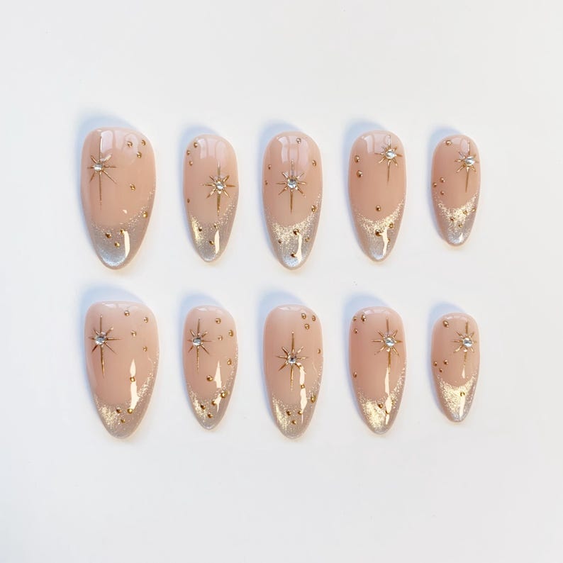 Luxury Nude Gold French Tip Press-On Nails with Starburst Rhinestone Design – Almond Shape Reusable Nail Set