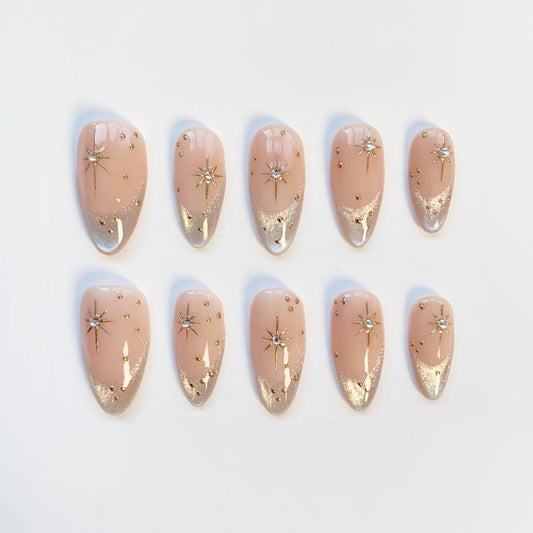 Luxury Nude Gold French Tip Press-On Nails with Starburst Rhinestone Design – Almond Shape Reusable Nail Set